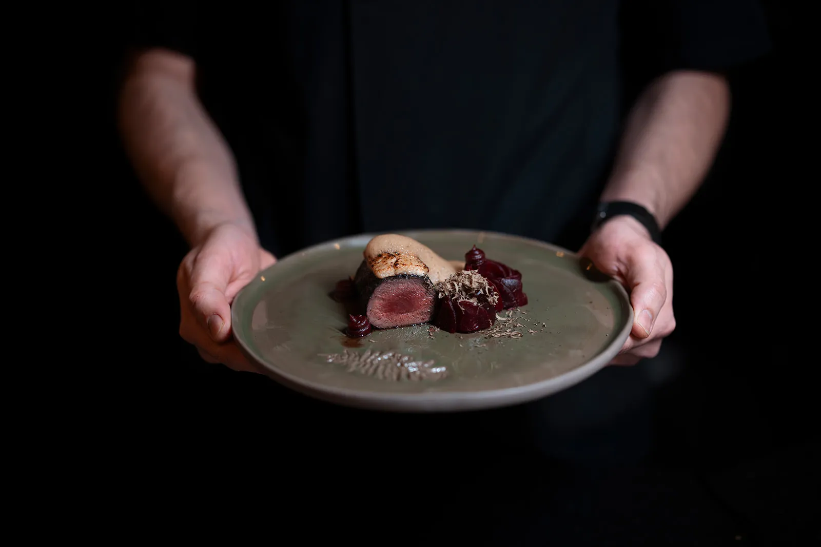 person holding plate with food